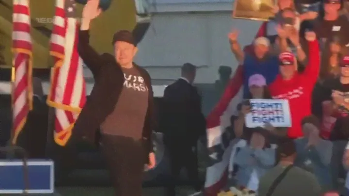 Elon Musk jumps around on stage as he joins Trump at rally